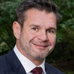 A. Thomas Skallas